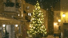 Snow falls over decorated streets in charming town square during holiday season. Winter in the citySnow falls in the city during the Christmas and New Year holidays - Powered by Shutterstock - Get 15% off with code: PIKWIZARD15