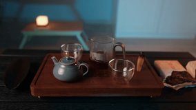Chinese tea ceremony and mindful relaxation pouring hot tea in calm atmosphere with steam and warm light cozy tea ritual relaxing moment vertical video - Powered by Shutterstock - Get 15% off with code: PIKWIZARD15