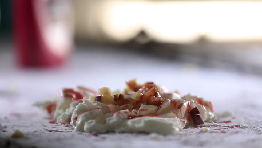 Mixing different flavour ice cream with knife.