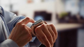 Smart watch using in office, Successful asian businessman use smartwatch at workplace, man chooses apps and smile happy with apps, employee inside office use laptop at work. - Powered by Shutterstock - Get 15% off with code: PIKWIZARD15