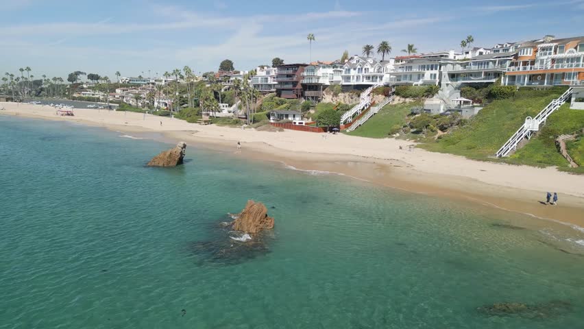 Close up drone footage of powerful ocean waves crashing against the shoreline at Newport Beach Orange County California USA surf texture and seascape background in cinematic 4K