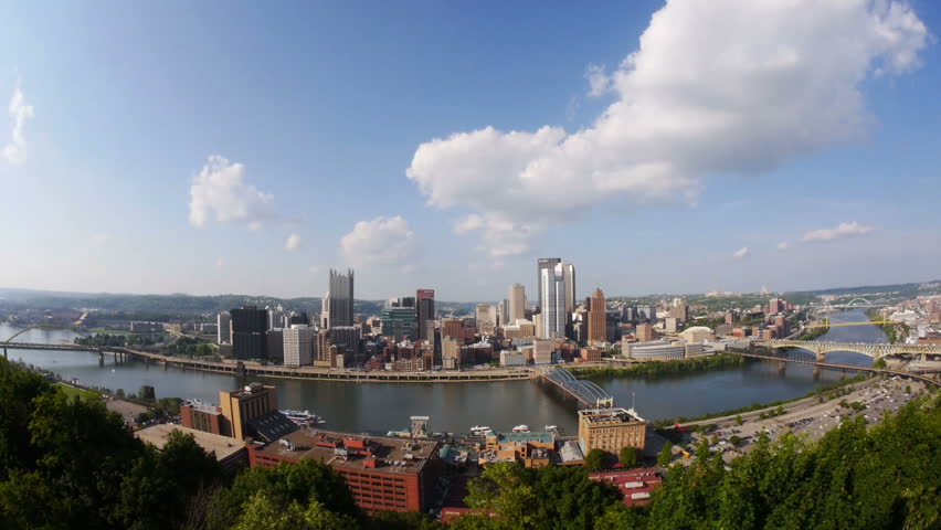 A fish eye view tilting up from the Pittsburgh skyline.