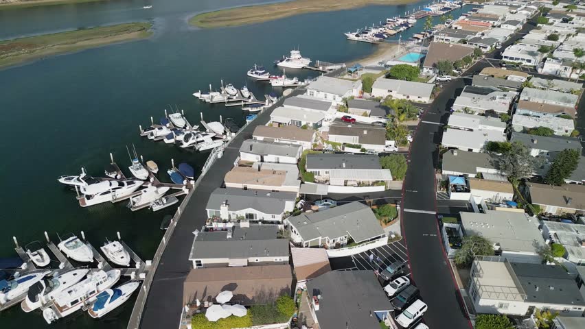 Drone aerial footage of Costa Mesa coastline in Orange County California USA sandy beach ocean water and horizon seascape background