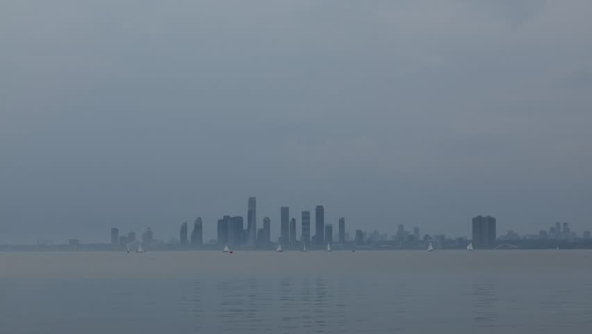 Time-lapse footage of Toronto’s waterfront under overcast skies. Recorded in Toronto, Ontario, Canada.