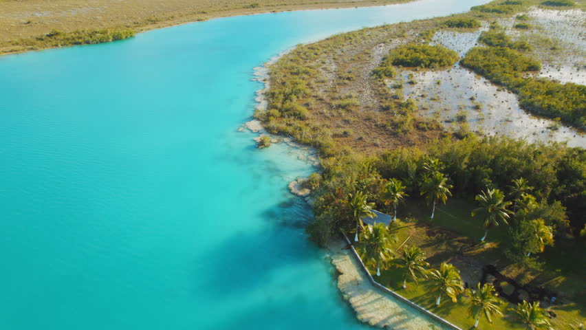 Aerial landscape of turquoise water and tropical forest at Bacalar lagoon Mexico