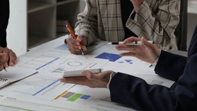 Group of business people analyzing financial graphs and charts during a corporate meeting - Powered by Shutterstock - Get 15% off with code: PIKWIZARD15