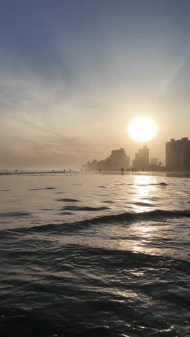 Pacific Ocean beach at sunset, Panoramic view of the golden hour, Brazil with your feet in the sand