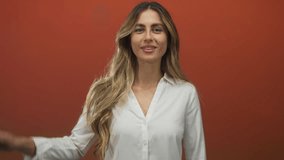 Woman raises right hand and places left hand on chest in studio; oath loyalty commitment. - Powered by Shutterstock - Get 15% off with code: PIKWIZARD15