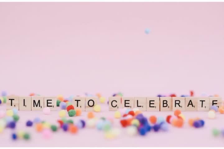 Stop Motion Animation of 'Time to Celebrate' Scrabble Tiles with Pom Poms