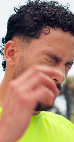 Athlete, fitness and man with headache outdoor from intense workout, dehydration and discomfort. Runner, pain and person with tension migraine from endurance challenge, overworked and massage temples