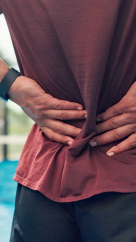 Hands, back pain and man on tennis court with injury, joint inflammation or training accident. Sports, health and padel player with sore spine, massage or athlete with muscle tension for outdoor game