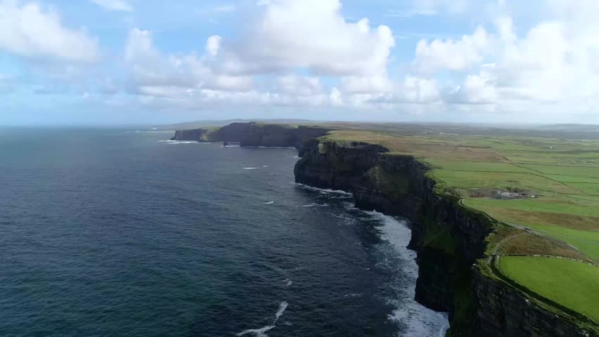 Explore stunning coastal cliffs in Ireland on a sunny day