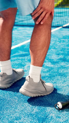 Hands, leg pain and man with injury on padel court, joint inflammation or training accident. Sports, health and tennis player with sore calf, massage or athlete with muscle tension at outdoor game