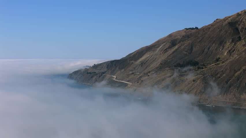 Discover breathtaking aerial views of the rugged coastline of Big Sur, which beautifully showcases the stunning expanse of the Pacific Ocean and the dramatic scenery found in Californias landscapes