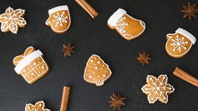 Christmas gingerbread cookies arranged with cinnamon sticks and star anise on dark background. - Powered by Shutterstock - Get 15% off with code: PIKWIZARD15