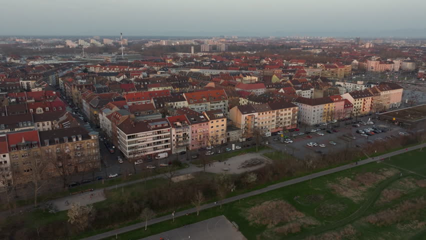 Aerial view moving over a residential neighborhood in Mannheim, Germany, revealing urban landscape and traditional buildings