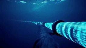  An animated visualization of submarine fiber optic cables transmitting data beneath the ocean surface, showcasing global connectivity and underwater technology infrastructure. - Powered by Shutterstock - Get 15% off with code: PIKWIZARD15
