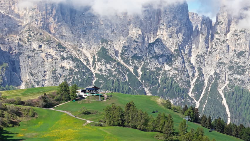 Dolomites alps Alpe di Siusi plateau oriented to the Catinaccio wall, aerial view. Mountain landscape of northern Italy