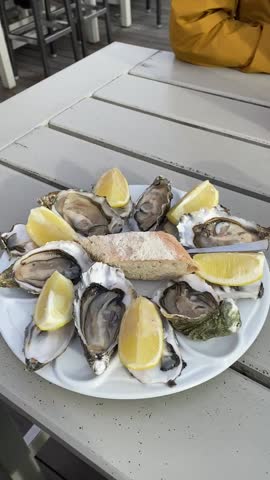 Fresh oysters with lemon served outdoors in Sankt Peter Ording Germany