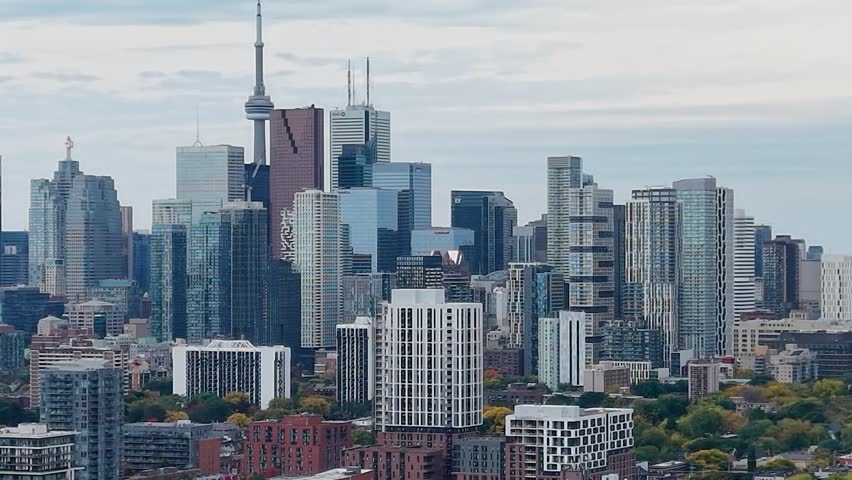 Beautiful drone view of the downtown Toronto skyline looking southwest in autumn, Ontario, Canada. Toronto architecture, CN Tower and skyscrapers.
