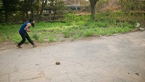 Cricketer Bowls Powerfully Through Lush Pathways, Bearded Player Practices Near Mossy Stone Figures, Sporting Energy playing by Green Wilderness Trail, Garden Workout Enhances Body Posture and Form - Powered by Shutterstock - Get 15% off with code: PIKWIZARD15