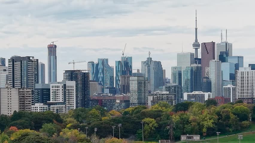 Beautiful drone view of the Riverdale Park and the downtown Toronto skyline looking southwest in autumn, Ontario, Canada. Toronto architecture, CN Tower and skyscrapers.