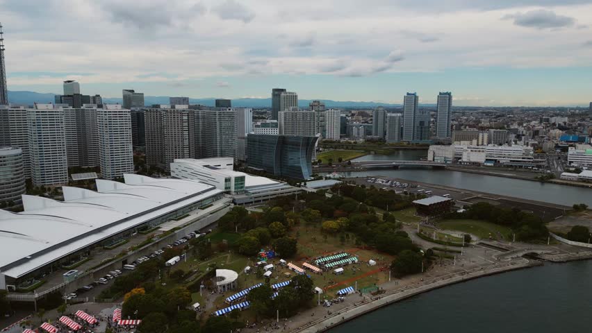 Aerial establishing shot of Yokohama Japan showing cultural event and skyline