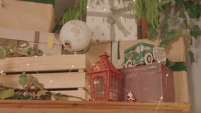 Cozy festive shelf with globe lantern toy car and wrapped presents - Powered by Shutterstock - Get 15% off with code: PIKWIZARD15