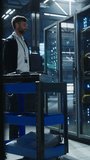 Technician moves a cart through a data center, opens a server rack, and inspects network hardware among rows of servers, equipment maintenance, cable management, a system reliability in a secure - Powered by Shutterstock - Get 15% off with code: PIKWIZARD15