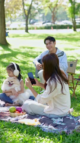 Enjoy a happy family picnic at the park during the holidays.