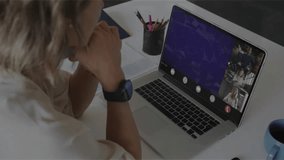 woman at desk initiating audio input while watching NFT call with waveform morphing into line graph. Technology, remote communication, digital workspace, data visualization, professional, creative, - Powered by Shutterstock - Get 15% off with code: PIKWIZARD15