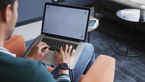 Seated man typing on laptop, spawning social-media icons showing engagement rising then dipping. Technology, social media, digital interaction, workspace, modern, communication, connectivity - Powered by Shutterstock - Get 15% off with code: PIKWIZARD15