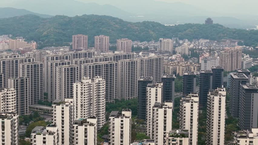Aerial view of dense apartment buildings in Hangzhou, China on a cloudy day