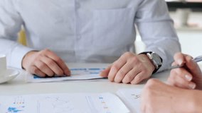 Multicultural employees group work together on project paperwork, Diverse business team people share ideas, brainstorm at office meeting table. - Powered by Shutterstock - Get 15% off with code: PIKWIZARD15