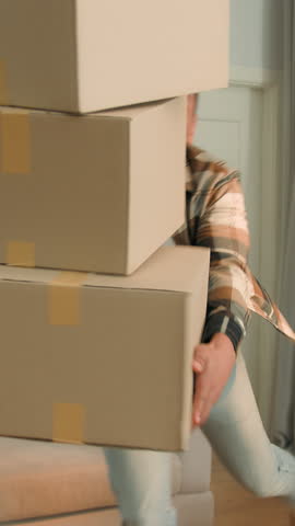 African American man dropping parcels coming in kitchen householder guy male carrying many boxes lost balance falling packages tired stressed in home house owner moving day problem trouble homeowner