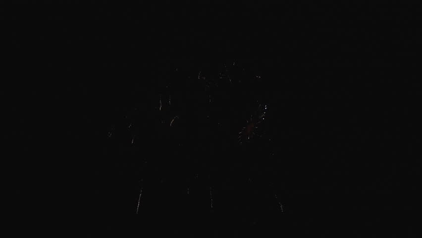 Fireworks on holiday celebration, 4k footage. Happy new year eve. Holiday firework pyrotechnics in night sky. Celebrating Christmas with fireworks. Fireworks celebrate anniversary