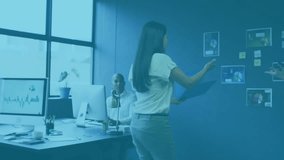 Presenter placing charts on blue wall, sparking floating social icons as team reviewing promo data. Collaboration, analytics, data visualization, office, teamwork, professional, digital - Powered by Shutterstock - Get 15% off with code: PIKWIZARD15