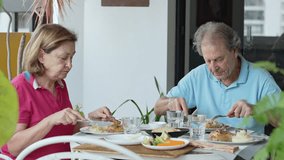 Elderly couple eating lunch together at home, intimate domestic moment showing companionship, daily routine, and quiet connection in natural daylight
 - Powered by Shutterstock - Get 15% off with code: PIKWIZARD15