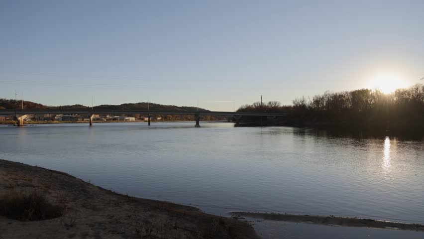 Bridge over Chippewa River in autumn sunset, Durand, Wisconsin - wide angle 4k shot
