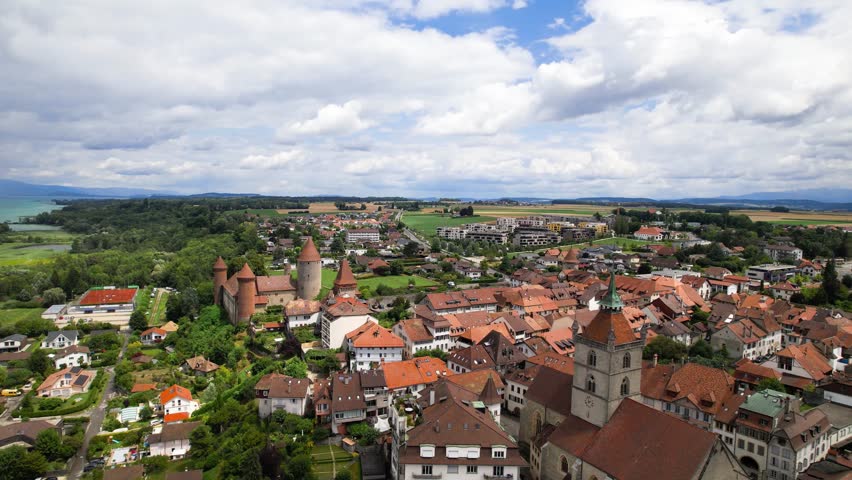 Switzerland tourism and scenic places. Estavayer-le-lac - charming traditional village, lake Neuchatel. aerial drone 4k hd video of medieval castle and old town. Canton Fribourg