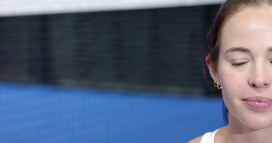 Athlete on blue court adjusting gaze as golden polygon web emerging shifting hues for tech demo. Technology, connectivity, innovation, digital, futuristic, sport, animation