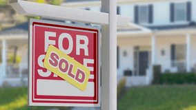 Agent Hand Presenting New House Key and Key Ring In Front of Sold For Sale Real Estate Sign and Beautiful New Home. - Powered by Shutterstock - Get 15% off with code: PIKWIZARD15