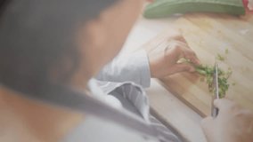 Home cook placing scallions and initiating knife slicing while droplets sliding, rippling meal prep. Culinary, kitchen, fresh, natural, lifestyle, minimalist, process - Powered by Shutterstock - Get 15% off with code: PIKWIZARD15