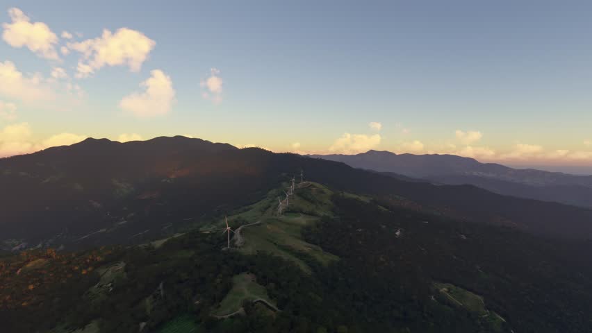 3D - Circular aerial shot at sunset of Eolico del Valle Central Park in Tabarcia. San Jose. Costa Rica