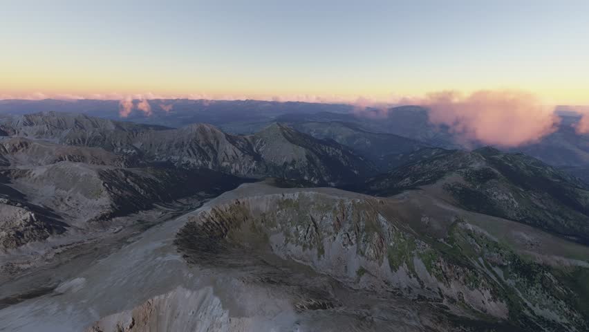 3D - Circular aerial drone view at sunset of Pic de la Dona Mountain in Mantet. France