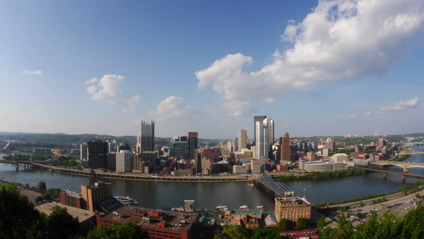 A time lapse of the Pittsburgh skyline. Logos obscured for stock footage use.