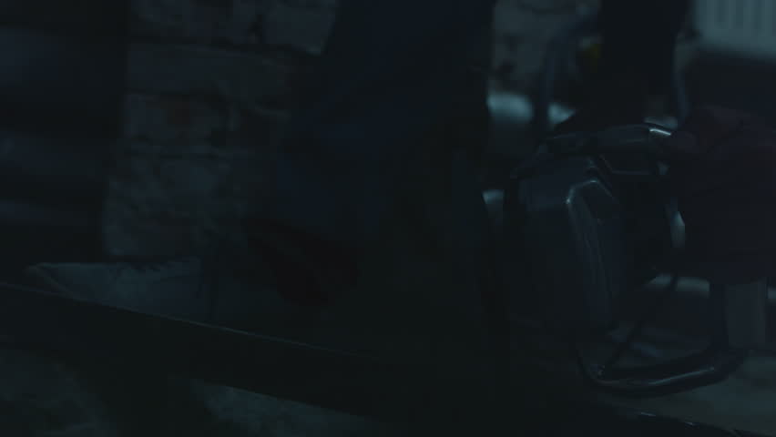 Sparks fly from cutting iron with a grinder. Disc cuts the steel material. Angle grinder, handyman worker using power tools grinding metal in a factory or at industrial plant.