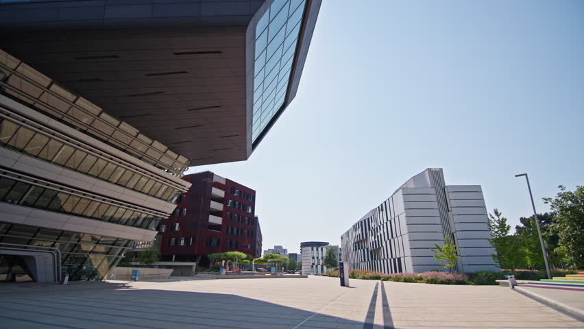 Modern cityscape of WU campus district in Vienna Austria with beautiful glass university and library buildings reflecting light in the downtown area of the European capital
