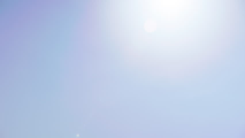 Historic brownstone houses along the Charles River with Boston skyline on a sunny day