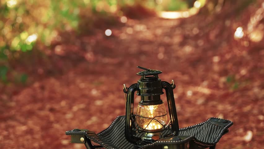 Autumn forest, lantern light, camping